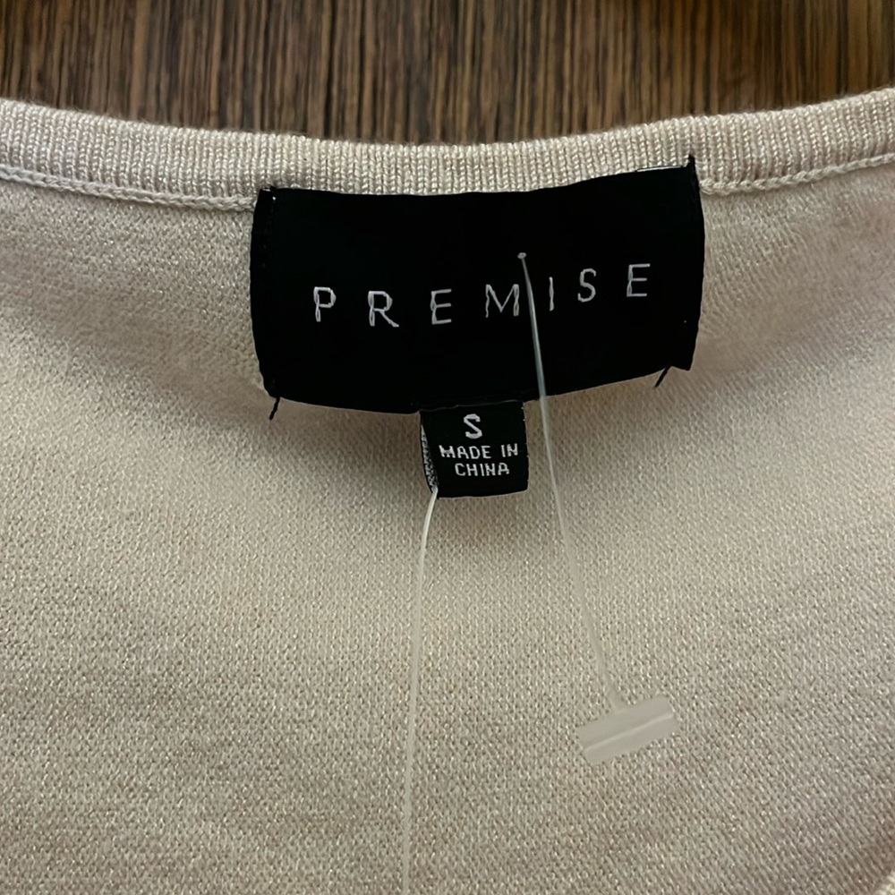 Size small premise, beige sweater three-quarter sleeve never worn tags on